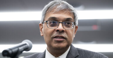 Jay Bhattacharya in a grey suit