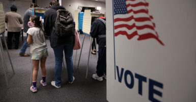 people at a voting booth