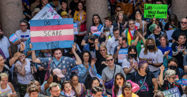 Transgender protest Austin Texas sign reads "Do I scare you?"