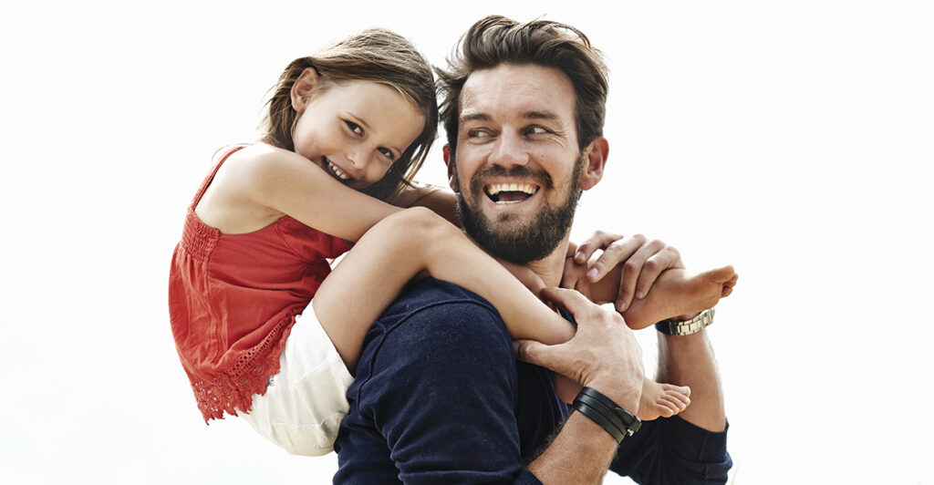 daughter on father's shoulders