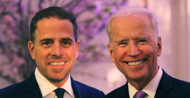 Hunter Biden and Joe Biden smiling in suits