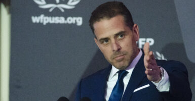 Hunter Biden gestures at a podium