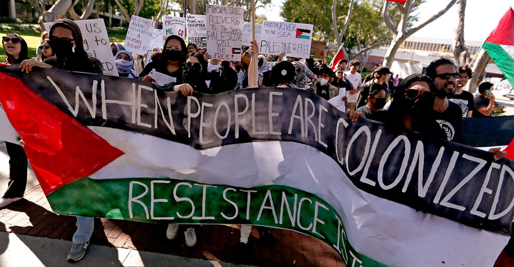 Pro-Palestine students protest on campus holding signs
