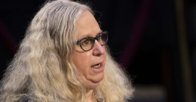Rachel Levine with a double chin speaks in a confirmation hearing with long blond hair