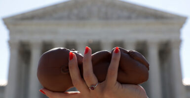 Republican Florida Sen. Marco Rubio has a plan for a Republican party struggling to message on abortion post Roe v. Wade. Pictured: a pro-life activist holds a model fetus during a demonstration in front of the U.S. Supreme Court June 29, 2020 in Washington, DC. (Photo by Alex Wong/Getty Images)