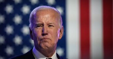 President Joe Biden With large American flag in background