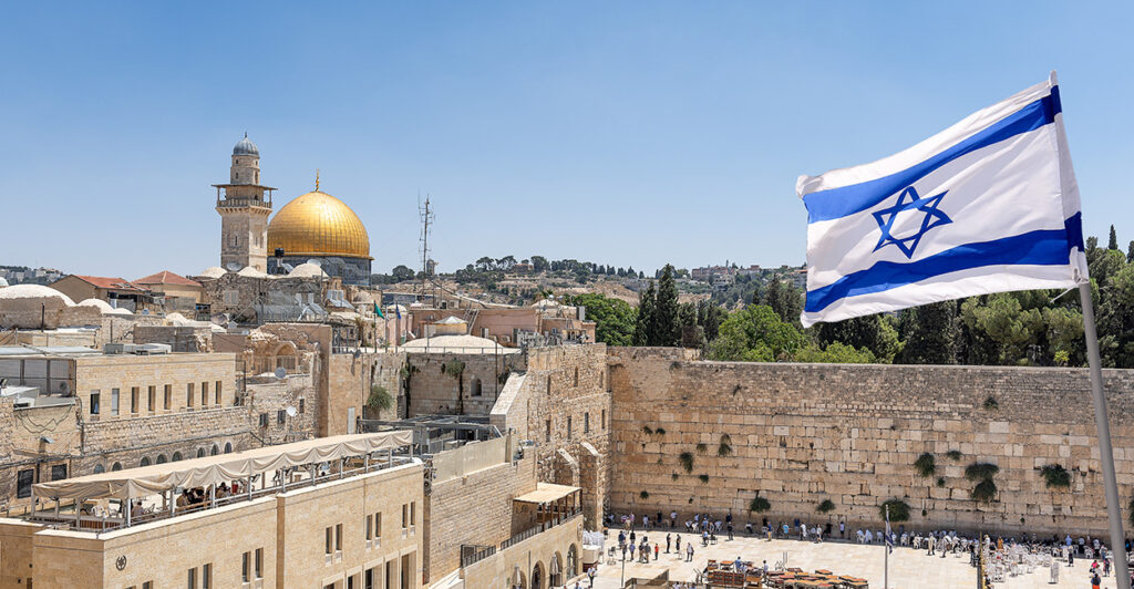 A Israeli flag is see flying over the Wailing Wall in Jerusalem.