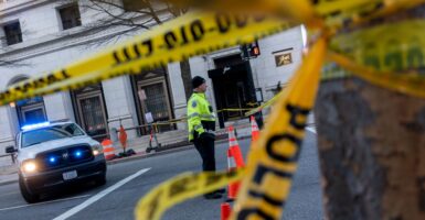 Police tape is seen at a crime scene.