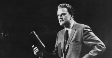 The Rev. Billy Graham holds a Bible in an undated file photo circa 1970.
