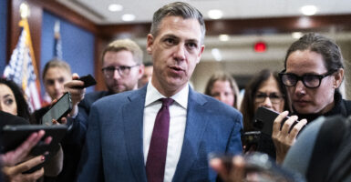 Rep. Jim Banks in a blue suit and purple tie