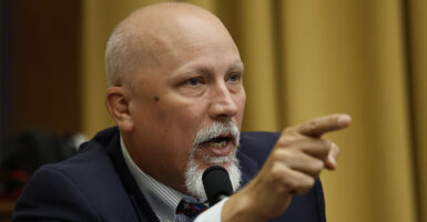 Chip Roy in a suit with a white goatee