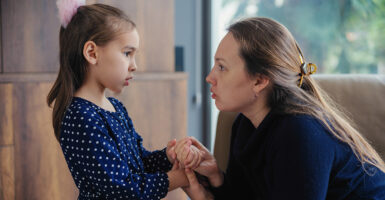 A mom consoles her young daughter.
