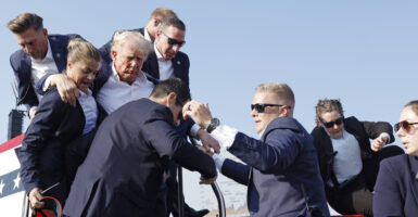 Republican presidential candidate former President Donald Trump is rushed offstage during a rally on July 13, 2024 in Butler, Pennsylvania. (Photo: Anna Moneymaker/Getty Images)