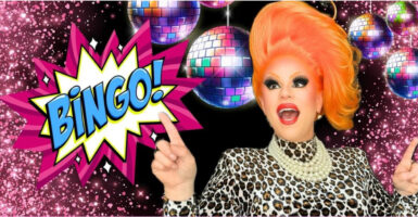 A drag queen points to the word, "Bingo!"