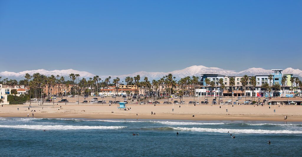 A California beach with mountains in the background.