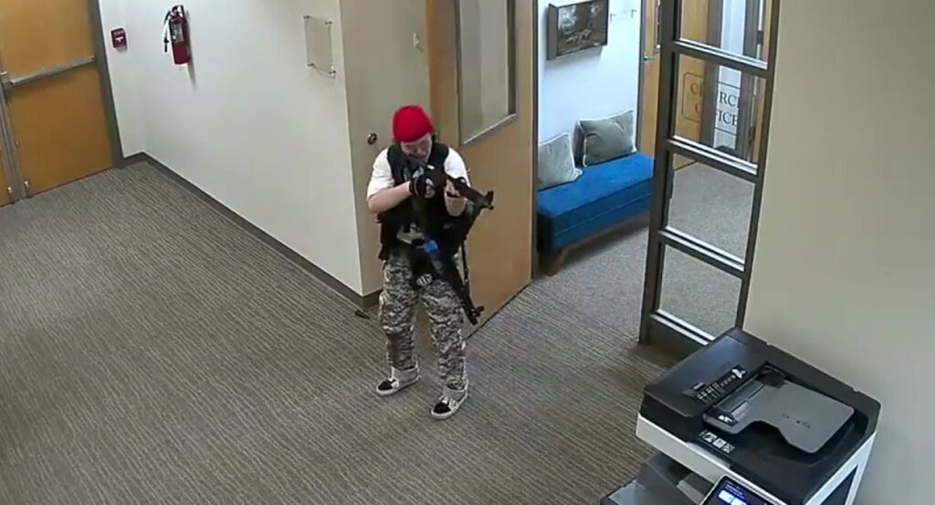 Audrey Hale with a gun and camoflage pants in The Covenant School