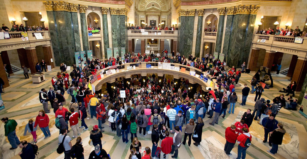 An aerial view of the Wisconsin state Capitol Rotunda filled with demonstrators in February 2011