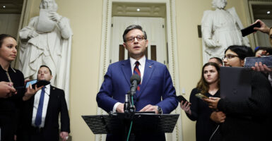 House Speaker Mike Johnson at a podium