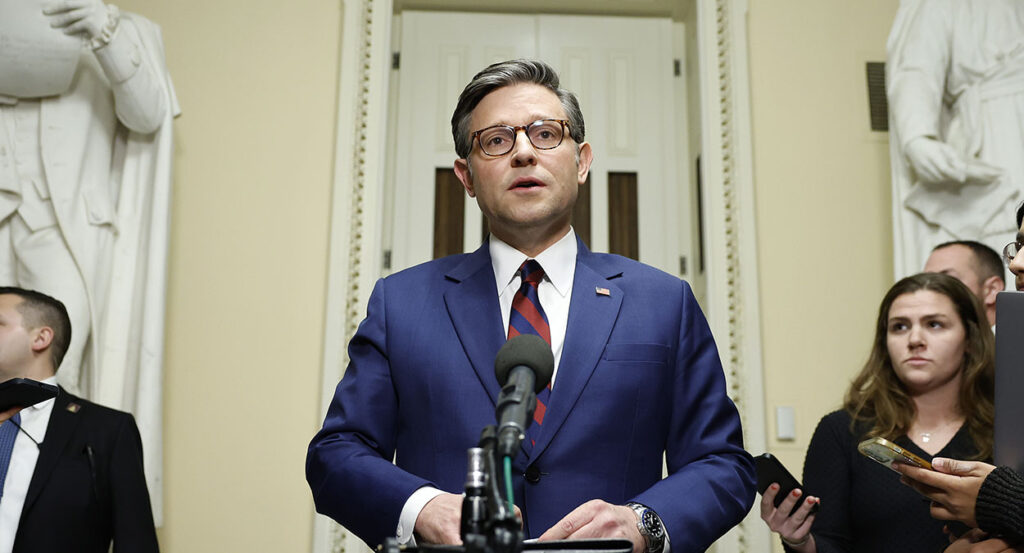 Mike Johnson in a blue suit