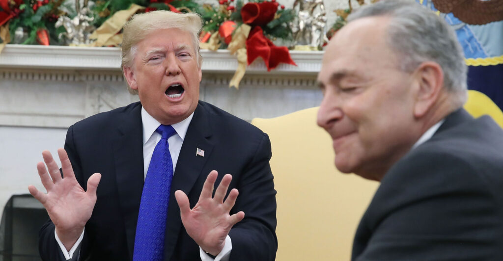President Donald Trump and Sen. Chuck Schumer, D-N.Y., confer in the Oval Office on Dec. 11, 2018.