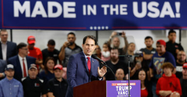 Former Wisconsin Gov. Scott Walker speaks at a campaign rally for then-presidential candidate Donald Trump in Waunakee, Wis., on Oct. 1.