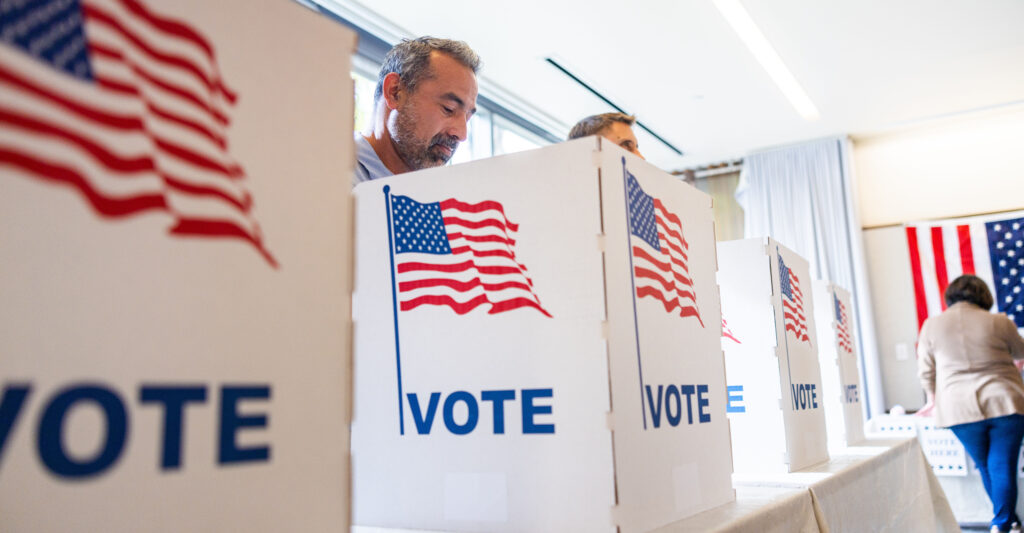 Voters marking their ballots at the polls