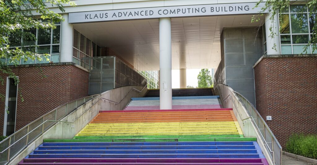 The steps leading inside to a college building have been painted the rainbow colors.