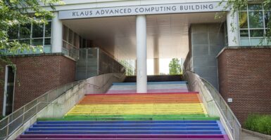 The steps leading inside to a college building have been painted the rainbow colors.