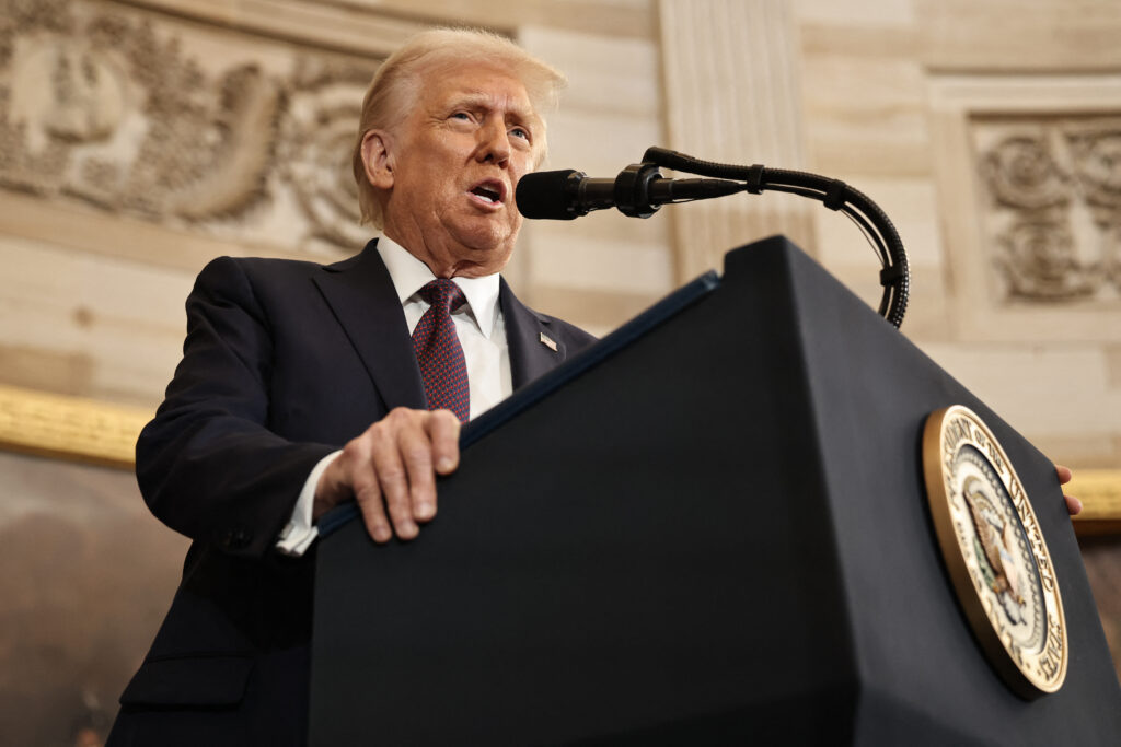 Donald Trump speaks to a crowd in the Capitol Rotunda