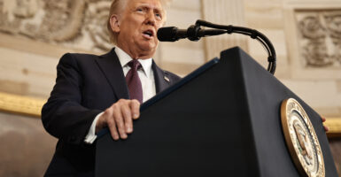 Donald Trump speaks to a crowd in the Capitol Rotunda
