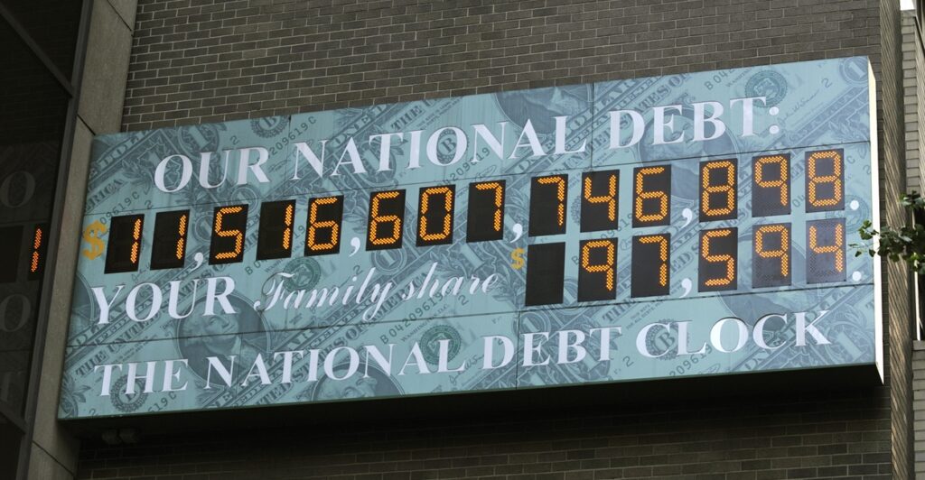 The digital National Debt Clock hangs on a wall in midtown New York.
