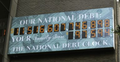 The digital National Debt Clock hangs on a wall in midtown New York.