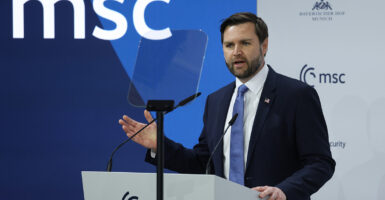 JD Vance speaks in a blue suit