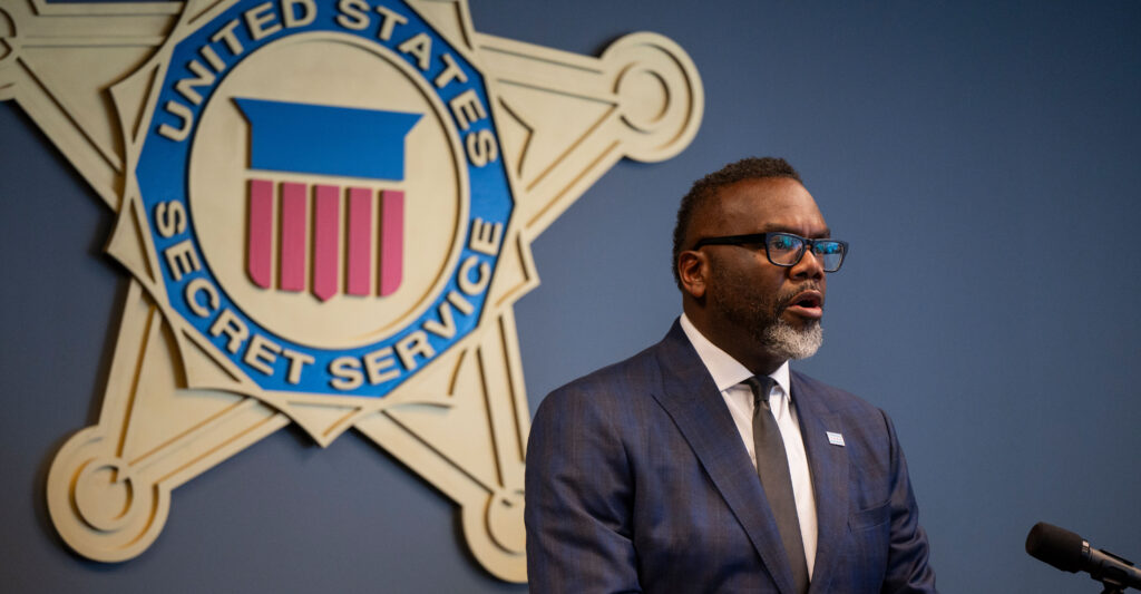 Chicago Mayor Brandon Johnson addresses a Democratic National Convention-related Secret Service security briefing on July 25 in Chicago with a Secret Service placard on the wall behind him.