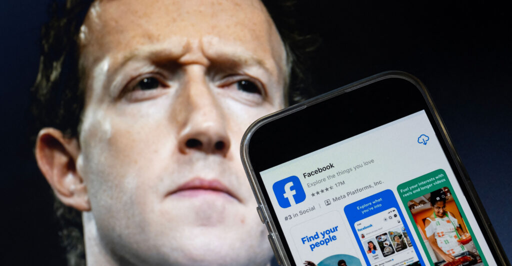 A photo illustration shows Mark Zuckerberg, CEO of Meta, with a phone displaying the Facebook app.