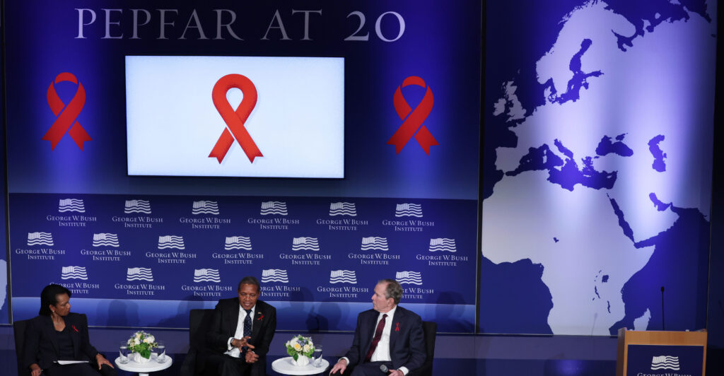 From left, former Secretary of State Condoleezza Rice, former Tanzanian President of Tanzania Jakaya Mrisho Kikwete, and former President George W. Bush participate in an event marking the 20th anniversary of PEPFAR on Feb. 24, 2023.