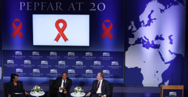 From left, former Secretary of State Condoleezza Rice, former Tanzanian President of Tanzania Jakaya Mrisho Kikwete, and former President George W. Bush participate in an event marking the 20th anniversary of PEPFAR on Feb. 24, 2023.