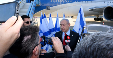 Benjamin Netanyahu talks to the press before leaving for the United States. Photo by Avi Ohayon (GPO) / Handout/Anadolu via Getty Images