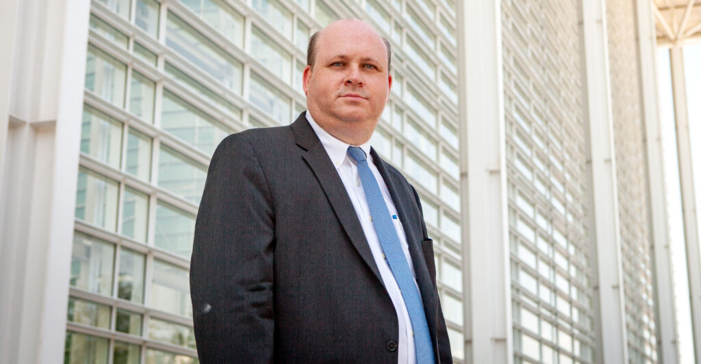 Democratic activist lawyer Marc Elias standing in front of a high-rise building