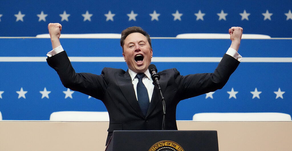Elon Musk exults with raised fists