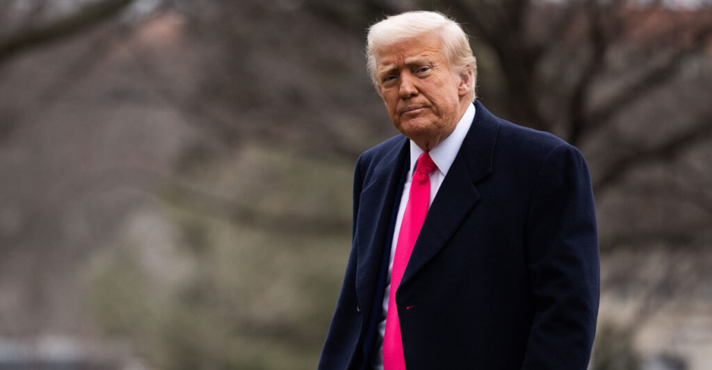 President Donald Trump walks outside.