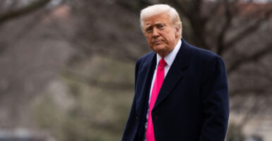 President Donald Trump walks outside.