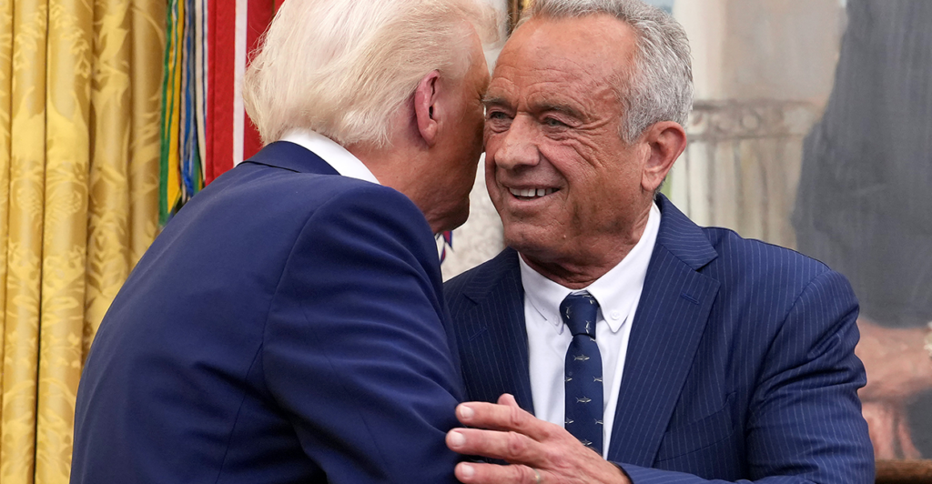 President Donald Trump embraces RFK Jr. at his swearing in as HHS Secretary.