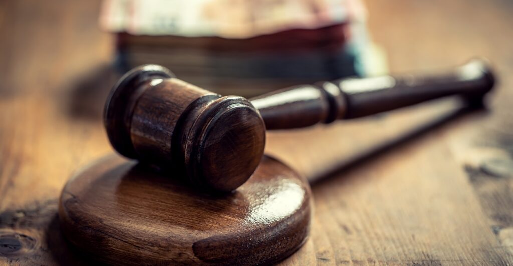 A gavel lays on a table.