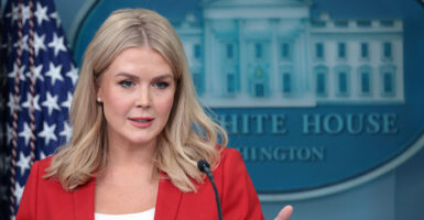 Trump press secretary Karoline Leavitt with the White House logo behind her