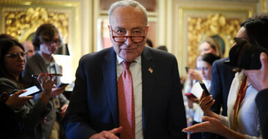 A scowling Senate Minority Leader Chuck Schumer, D-N.Y.