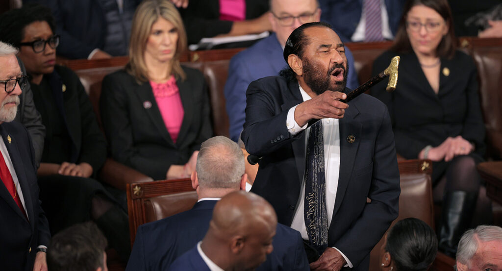 Rep. Al Green, D-Texas, shouts as President Donald Trump addresses a joint session of Congress on Tuesday night.