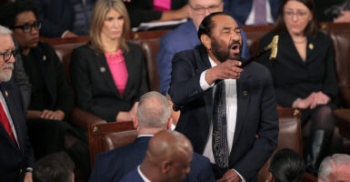 Rep. Al Green, D-Texas, shouts as President Donald Trump addresses a joint session of Congress on Tuesday night.