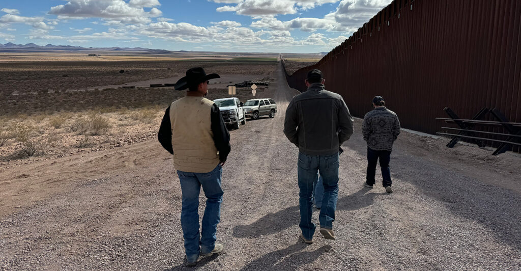 Rancher Russell Johnson walks with friends on his ranch in Luna County, New Mexico, along the border with Mexico, on March 12.