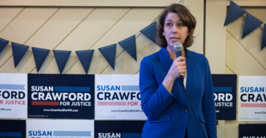 Backed by Democrats, Wisconsin Supreme Court candidate Susan Crawford speaks to supporters on Sunday in Racine, Wis.